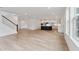 Open-concept living space with hardwood floors, a staircase, and a modern kitchen at 1738 Cultivation Ln # 532, Mount Pleasant, SC 29466