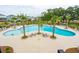 Resort-style community pool with palm trees and lounge chairs at 1738 Cultivation Ln # 532, Mount Pleasant, SC 29466