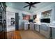 A lovely home office with painted wood walls and ceiling, wood floors, and stylish decor at 1763 Three Oaks Ave, Charleston, SC 29407