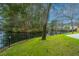 A well-maintained lawn leads to waterfront views from this home's backyard at 1908 Oak Tree Ln, Mount Pleasant, SC 29464