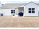 Well-maintained home exterior with a spacious backyard, perfect for entertaining and outdoor enjoyment at 2117 Colson Ln, Johns Island, SC 29455