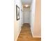 Clean hallway with hardwood floors and neutral wall colors, providing access to the bedrooms at 2117 Colson Ln, Johns Island, SC 29455