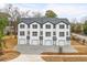 New townhouse complex with white siding and dark trim offers modern living at 2189 Helm Ave, North Charleston, SC 29405