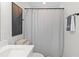 Cozy bathroom featuring shower with curtain, towel rack, and decorative art at 2193 Helm Ave, North Charleston, SC 29405