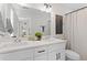 Well-lit bathroom featuring double sinks, modern fixtures, and decorative accents at 2193 Helm Ave, North Charleston, SC 29405