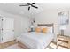 Bright bedroom with a vaulted ceiling, ceiling fan, wood floors, a cozy queen bed, and natural lighting at 2193 Helm Ave, North Charleston, SC 29405