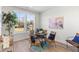 Bright dining area features light walls, wood floors, and an inviting round table with seating and natural light at 2193 Helm Ave, North Charleston, SC 29405