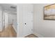 Hallway with hardwood floors, white trim, and natural light at 2193 Helm Ave, North Charleston, SC 29405