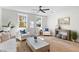 Bright living room featuring hardwood floors, white walls, and modern furniture, creating a cozy and inviting space at 2193 Helm Ave, North Charleston, SC 29405