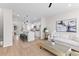 Open-concept space featuring a modern kitchen with an island and a comfortable living area, perfect for entertaining at 2193 Helm Ave, North Charleston, SC 29405