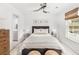 Bright bedroom featuring a ceiling fan, patterned bedding, and natural light from the window at 231 Abercom Place Dr, Moncks Corner, SC 29461