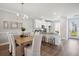 Dining area features light and airy atmosphere, with wood floors and modern lighting at 231 Abercom Place Dr, Moncks Corner, SC 29461