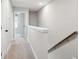 Upstairs hallway with carpet and neutral paint, adjacent to a bedroom at 231 Abercom Place Dr, Moncks Corner, SC 29461
