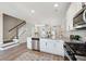 Open kitchen with granite countertops, stainless steel appliances, and hardwood flooring at 231 Abercom Place Dr, Moncks Corner, SC 29461