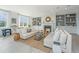 Bright and airy living room featuring a fireplace, custom built-ins, and comfortable seating arrangement at 245 Seven Farms Dr # 330, Charleston, SC 29492