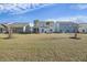 Wide view of backyard shows mature trees, screened patio, and large grassy area at 310 Silent Bluff Dr, Summerville, SC 29486