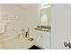 Bright bathroom featuring a modern vanity with granite countertop and stylish decorative wall art at 310 Silent Bluff Dr, Summerville, SC 29486