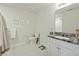 Clean, modern bathroom features a vanity with granite countertops, tile flooring, and good lighting at 310 Silent Bluff Dr, Summerville, SC 29486