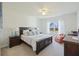 Bright bedroom featuring a wooden bed frame, carpet, and a window with natural light at 310 Silent Bluff Dr, Summerville, SC 29486