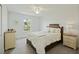 Bright bedroom with a ceiling fan, comfortable bed, and large window letting in natural light at 310 Silent Bluff Dr, Summerville, SC 29486