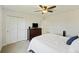 Bedroom boasts a ceiling fan, closet, a dresser, and a large, comfortable bed at 310 Silent Bluff Dr, Summerville, SC 29486