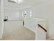 Bright and spacious bonus room with neutral carpet, multiple windows, and versatile layout options at 310 Silent Bluff Dr, Summerville, SC 29486