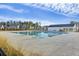 Community pool offers a refreshing oasis with lounge areas, seating, and plenty of space to relax at 310 Silent Bluff Dr, Summerville, SC 29486