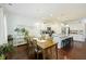 Open dining room with island counter with barstool seating and natural lighting at 310 Silent Bluff Dr, Summerville, SC 29486