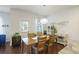 Dining area showcasing a wooden table, plants, decor, and natural lighting at 310 Silent Bluff Dr, Summerville, SC 29486