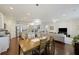 Dining area showcasing the kitchen, dining room, and living room with natural lighting at 310 Silent Bluff Dr, Summerville, SC 29486