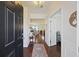 Inviting home foyer with hardwood floors, chandelier, and views to the living room and bedrooms at 310 Silent Bluff Dr, Summerville, SC 29486