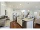 Open kitchen with center island, stainless steel appliances, and staircase at 310 Silent Bluff Dr, Summerville, SC 29486