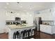 Open-concept kitchen with granite countertops, stainless appliances, and breakfast bar seating at 310 Silent Bluff Dr, Summerville, SC 29486
