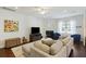 Living room showcasing a fireplace, flat screen tv, ceiling fan, and cozy seating arrangement at 310 Silent Bluff Dr, Summerville, SC 29486
