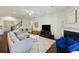 Cozy living room with fireplace, tv, sectional couch, and beautiful wood floors at 310 Silent Bluff Dr, Summerville, SC 29486