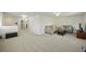 Spacious living room features neutral paint and plush carpeting with plenty of natural light at 310 Silent Bluff Dr, Summerville, SC 29486