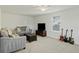 Comfortable living room featuring neutral colored couches, a TV, and guitars against a wall at 310 Silent Bluff Dr, Summerville, SC 29486