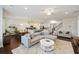 Open-concept living area with hardwood floors, a kitchen, a dining area, and comfortable seating at 310 Silent Bluff Dr, Summerville, SC 29486