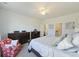 Bright main bedroom with white walls, ceiling fan, wood dresser, and comfortable bed at 310 Silent Bluff Dr, Summerville, SC 29486