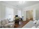 Office room with windows, accent chair, desk, and daybed at 310 Silent Bluff Dr, Summerville, SC 29486