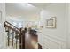 Entryway view into open floor plan with hardwood floors, kitchen island, and dining area at 310 Silent Bluff Dr, Summerville, SC 29486
