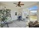 Inviting screened porch with comfortable chairs and hanging chairs, ideal for enjoying outdoor living at 310 Silent Bluff Dr, Summerville, SC 29486