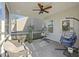 Relaxing screened-in porch with comfortable chairs and hanging swing chairs, perfect for outdoor enjoyment at 310 Silent Bluff Dr, Summerville, SC 29486