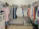 Spacious walk-in closet with ample shelving and hanging storage for clothes and accessories at 310 Silent Bluff Dr, Summerville, SC 29486