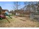 The backyard features a playset, storage shed, and a full chain link fence at 311 Macgregor Dr, Summerville, SC 29486