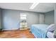Bedroom featuring wood floors, bright overhead lighting, and a window at 311 Macgregor Dr, Summerville, SC 29486