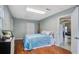 Bedroom with hardwood floors, bed, white walls and two doors at 311 Macgregor Dr, Summerville, SC 29486