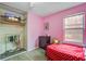 Pink bedroom features bed with polka-dot comforter, dresser and closet at 311 Macgregor Dr, Summerville, SC 29486