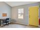 Study area with a desk and a window allowing natural light and a yellow door at 311 Macgregor Dr, Summerville, SC 29486