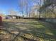 A sprawling, grassy backyard with trees and a screened-in porch offers plenty of room for recreation and relaxation at 338 Holly Ave, Goose Creek, SC 29445